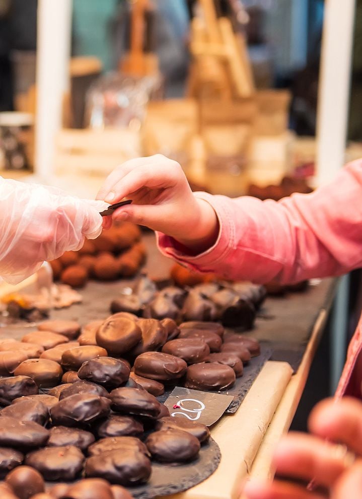 girl buying chocolate