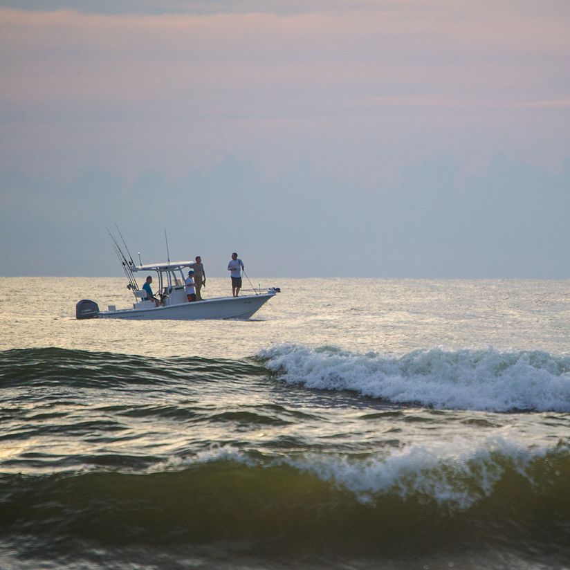 people fishing in the ocean